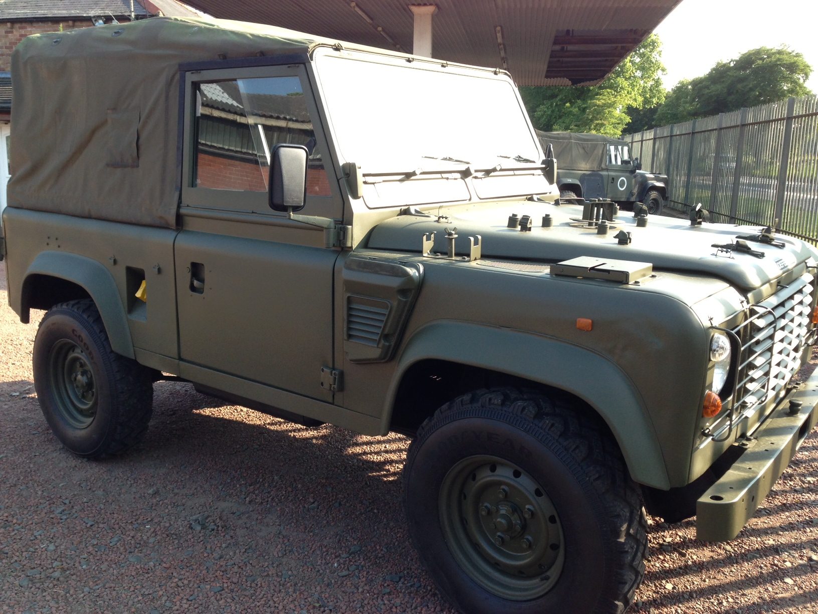 Ex-MOD Land Rover Wolf 90 soft top on gravel